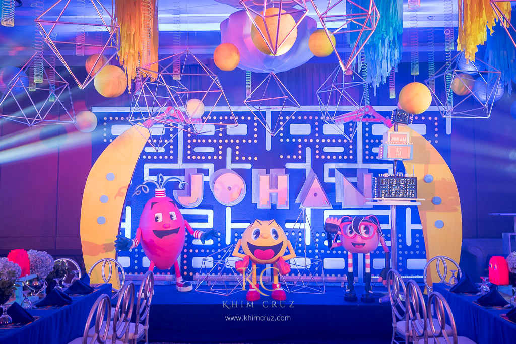 Pacman kids birthday stage setup with characters