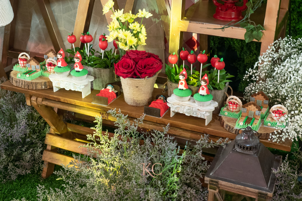 little red riding hood themed childrens birthday party dessert table setup details