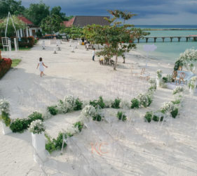 Outdoor beach wedding ceremony aerial view unique curved pathway design