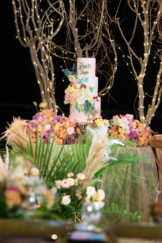 davao pearl farm destination wedding cake with floral arrangements of Vina & Paolo styled by Khim Cruz