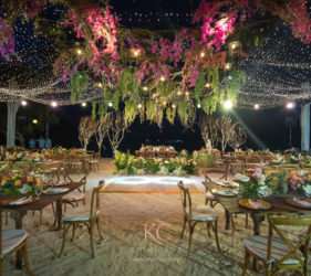Intimate beach wedding reception at night