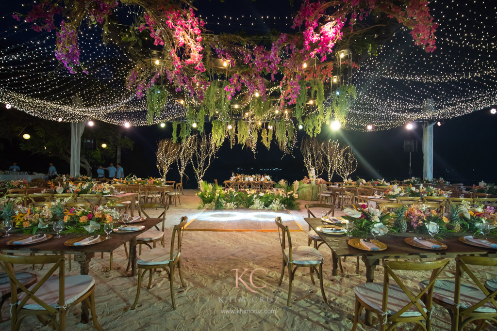 Intimate beach wedding reception at night