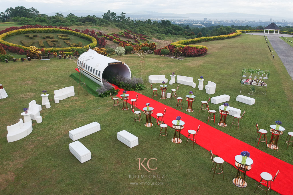 Travel themed wedding cocktail area with fuselage