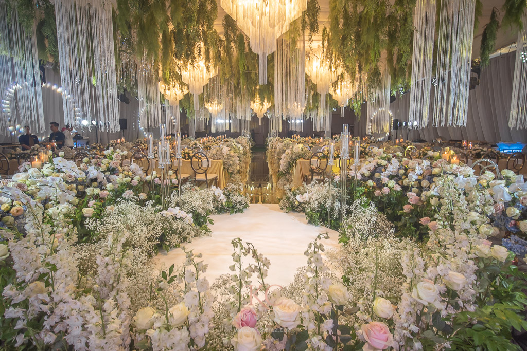 Floral design encircling wedding dance floor