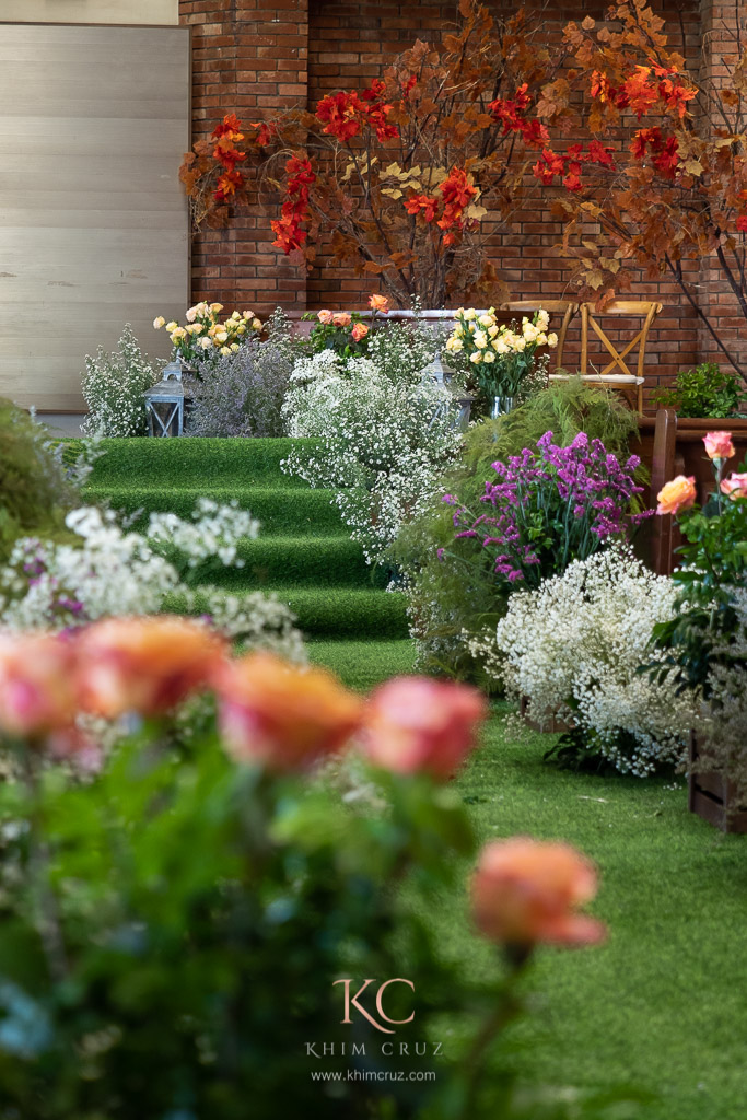 Garden feel wedding ceremony pathway floral details