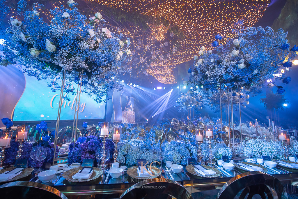 Ombre table centerpieces on a starry night themed wedding reception