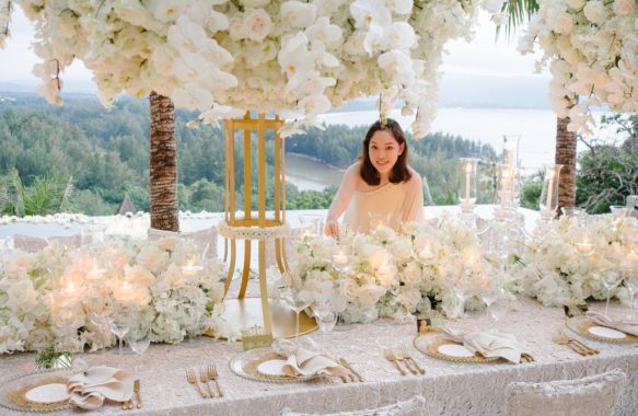 Khim Cruz working on head table floral design