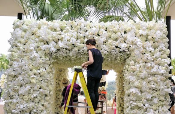 Khim Cruz working behind the scenes floral entrance