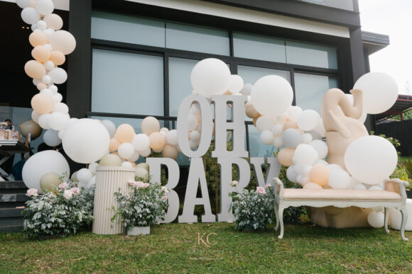 muted safari gender reveal party cake and reveal area by Khim Cruz