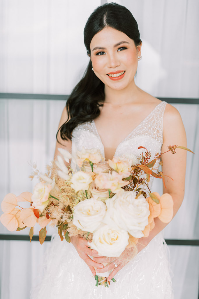 beautiful bride with her bouquet made by Khim Cruz