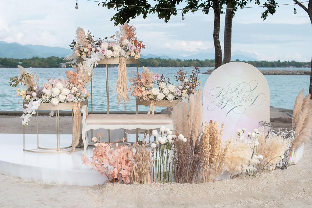 muted elegance photowall of Kirk and Michele by the beach florals by Khim Cruz