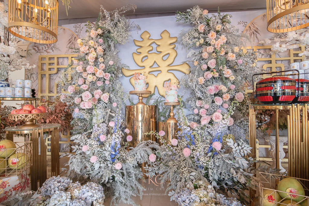 Chinese engagement Tinghun of EJ & Jaira on a floral arch backdrop with double happiness by event stylist Khim Cruz