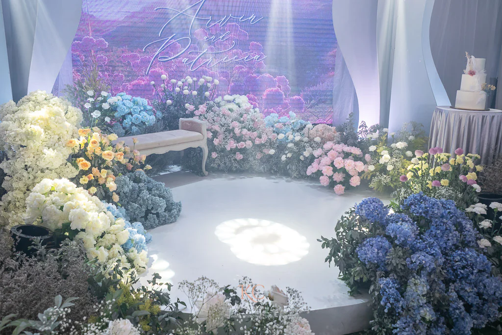 a modern-feel garden themed wedding reception stage and dance floor with flowers for Arvin and Patricia by Khim Cruz