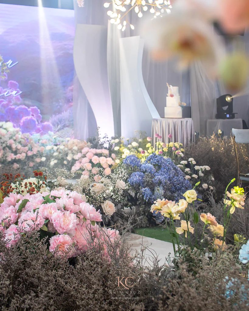 a modern-feel garden themed wedding reception stage details with wedding cake for Arvin and Patricia styled by Khim Cruz