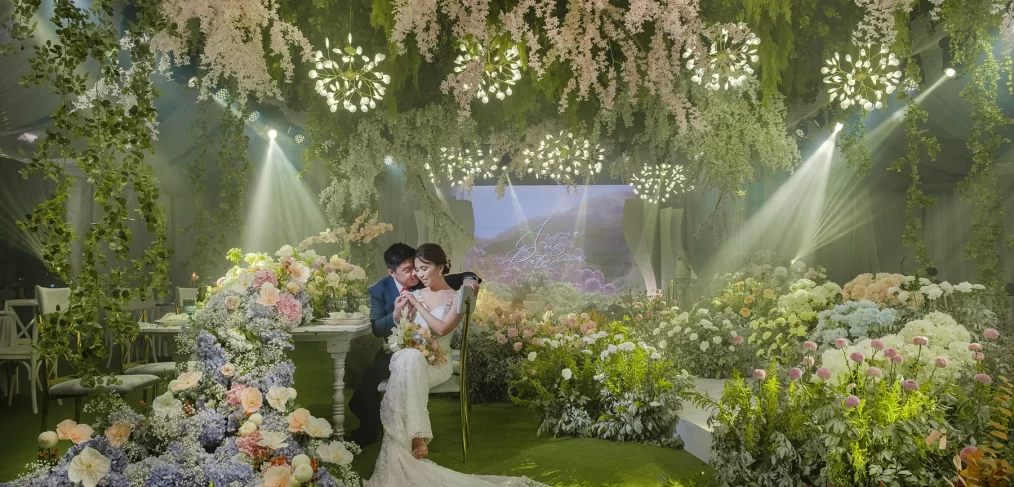 couple on their modern-feel garden themed wedding reception by wedding designer Khim Cruz