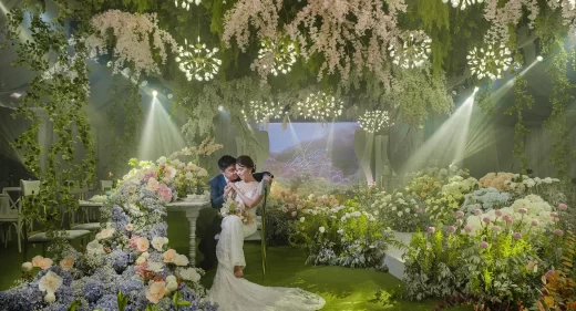couple on their modern-feel garden themed wedding reception by wedding designer Khim Cruz