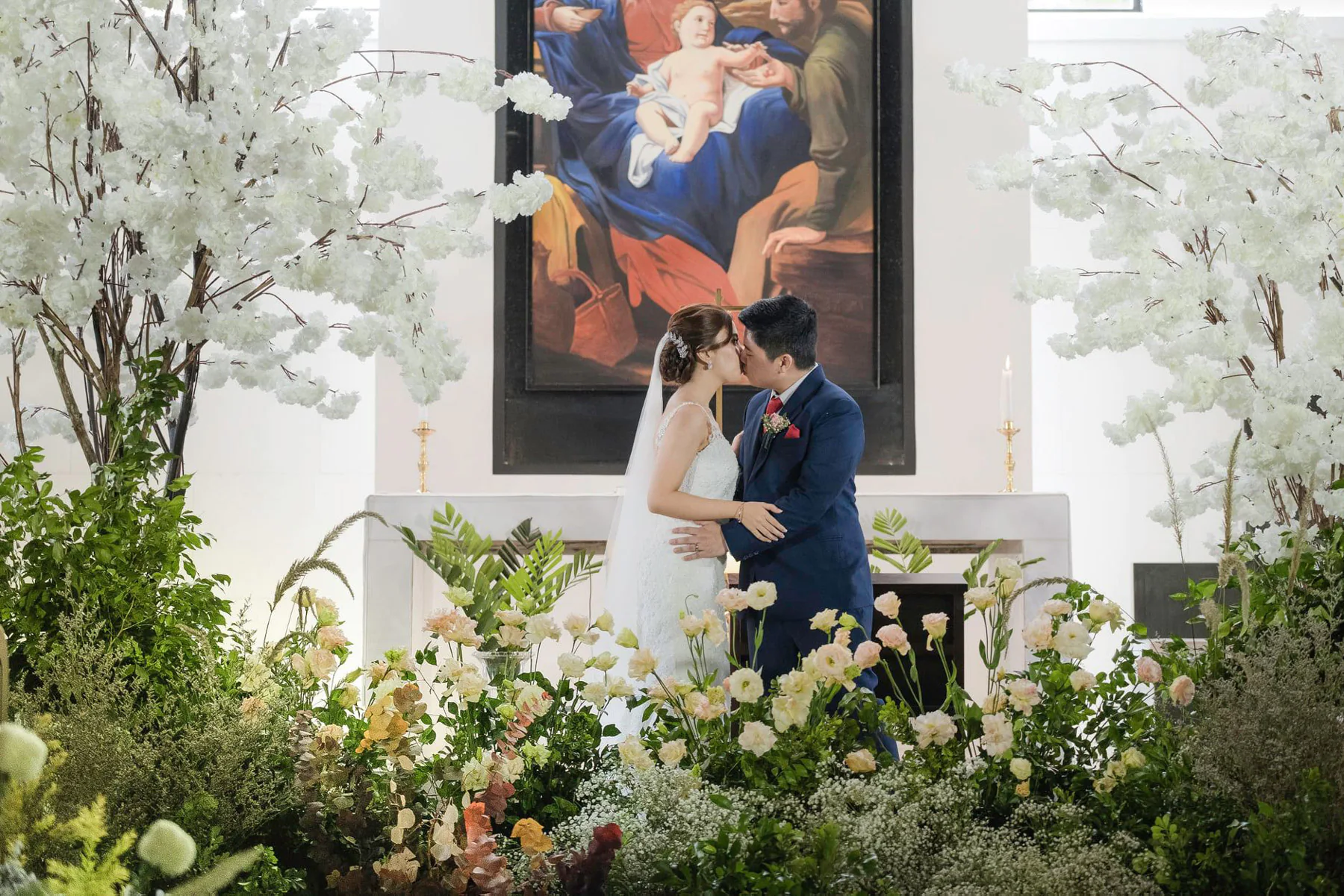 lovely couple on ceremony floral setup by Khim Cruz