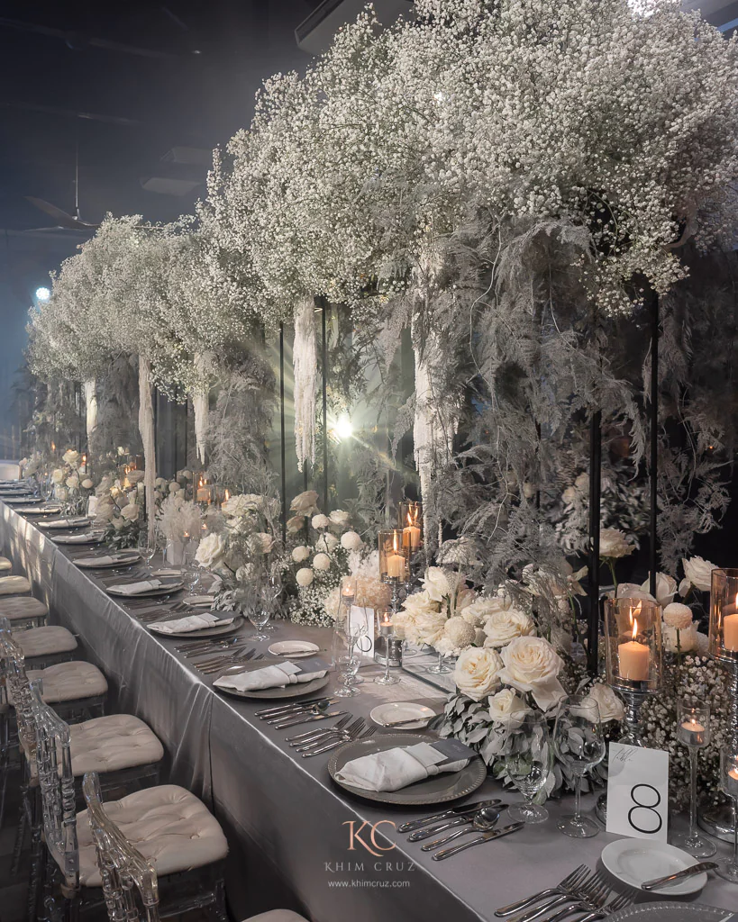 modern contemporary with a touch of black and cloud like gypsophila on table at the wedding reception for Bong and Charmaine by Khim Cruz