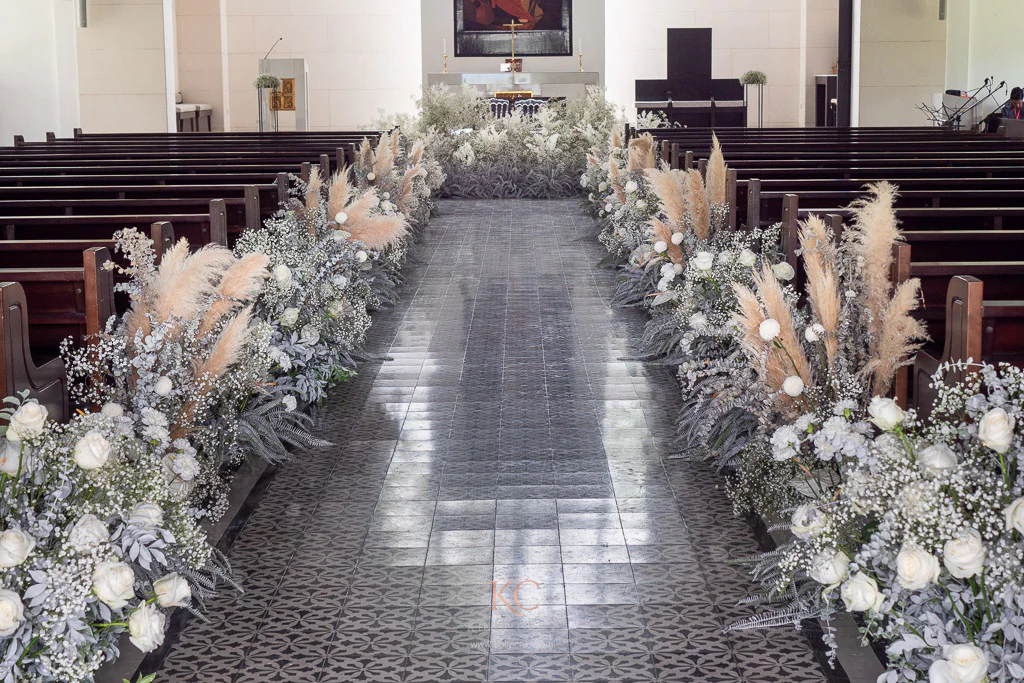 wedding ceremony with gypsophilas on aisle for Bong and Charmaine by event stylist Khim Cruz