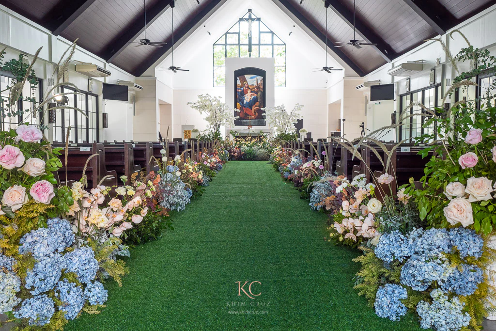 wedding ceremony with low-lying crawling floral arrangements for Arvin and Patricia by Khim Cruz