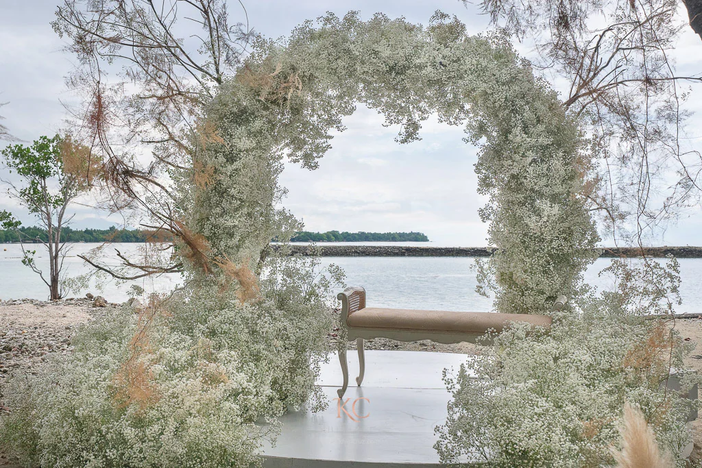 Boho wedding ceremony by the beach of Neil and Mieko with Gypsophila ceremonial arch by Khim Cruz