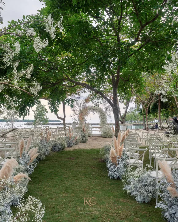 Boho wedding ceremony by the beach of Neil and Mieko with Gypsophila designed by Khim Cruz