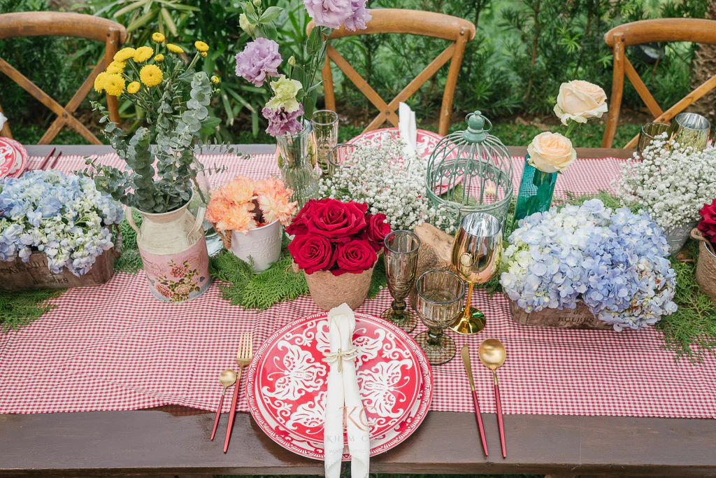 little red riding hood kids birthday party table setting with floral centerpiece by Khim Cruz