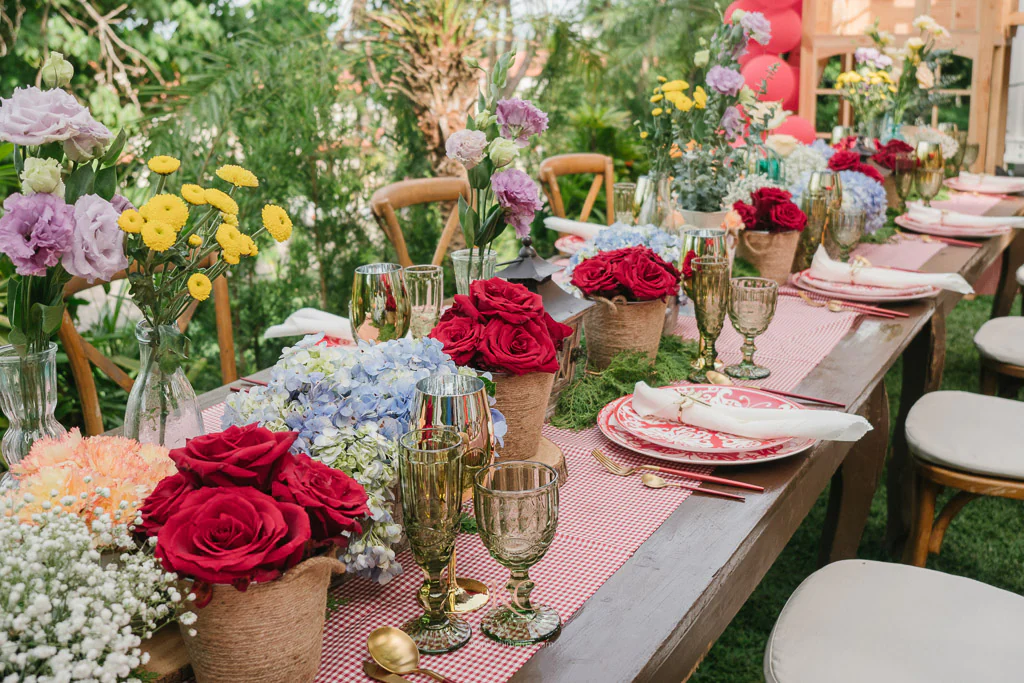 little red riding hood table setting with flower centerpieces and table setting arranged by Khim Cruz
