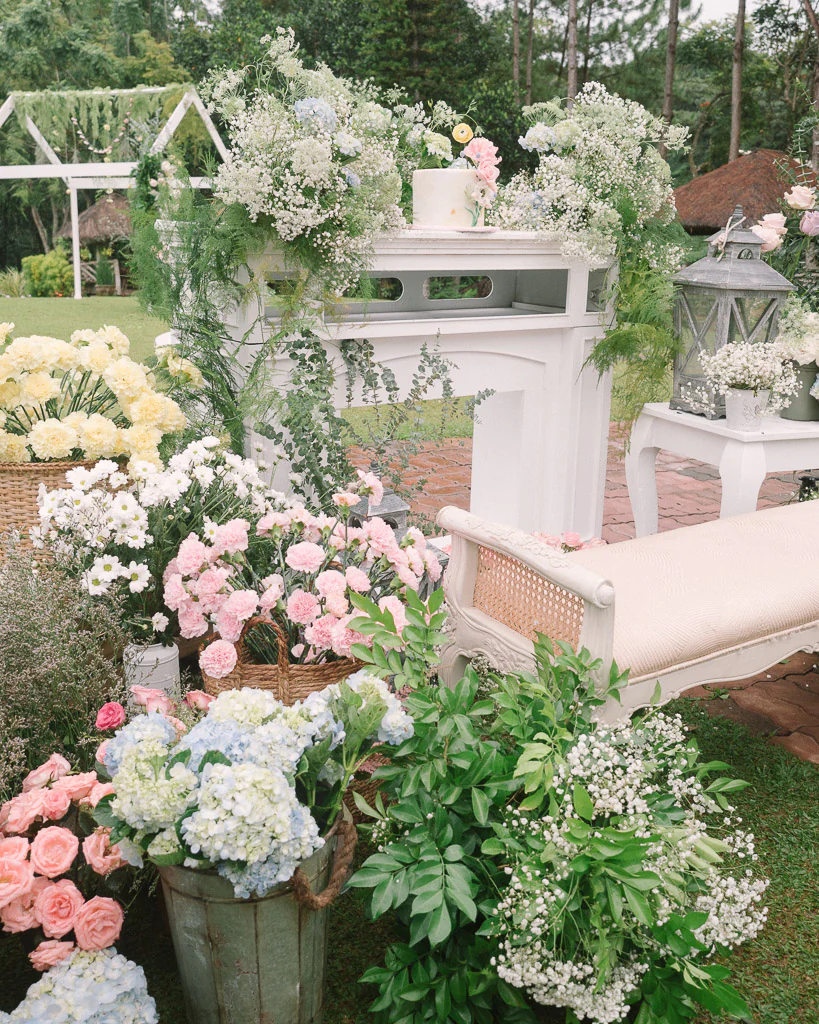 an outdoor 10th wedding anniversary ceremony for Pher and Iah with fresh flowers