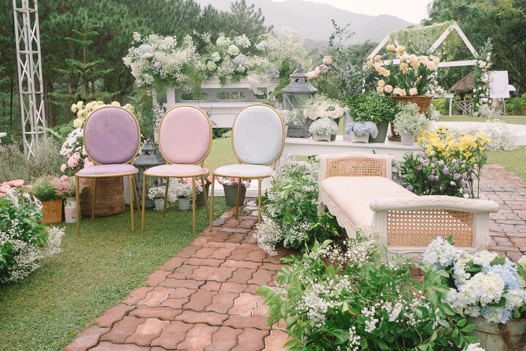 an outdoor 10th wedding anniversary ceremony with fresh florals on a beautiful mountain backdrop by Khim Cruz for Pher and Iah
