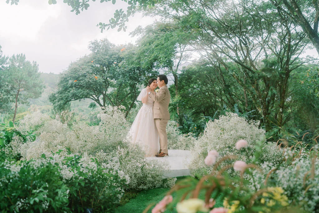 an outdoor 10th wedding anniversary renewal of vows ceremony with Pher and Iah dancing on stage designed by Khim Cruz