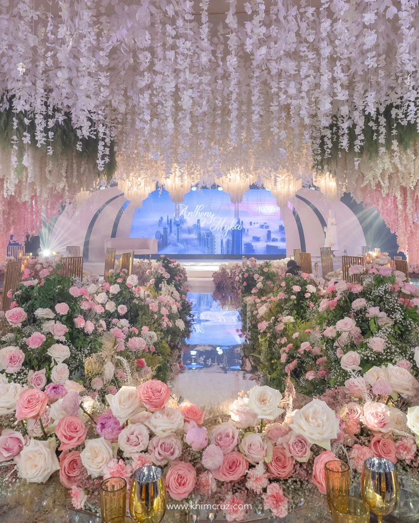 a sophisticated travel themed wedding reception for Anthony and Myka floral pathway leading to the globe inspired setup