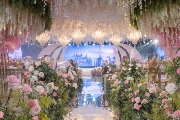 a sophisticated travel themed wedding reception for Anthony and Myka floral pathway on a mirror panel flooring leading to the globe meridian inspired stage