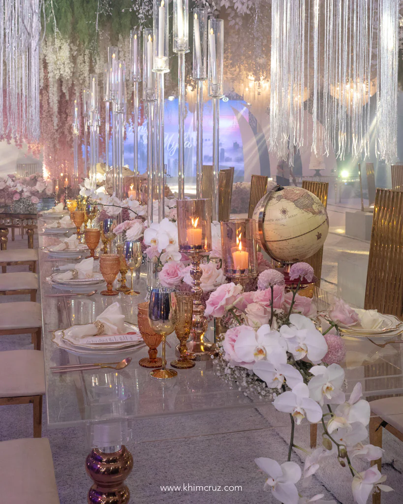 a sophisticated travel themed wedding reception for Anthony and Myka table floral arrangement with gypsophila candles and candelabras and travel elements