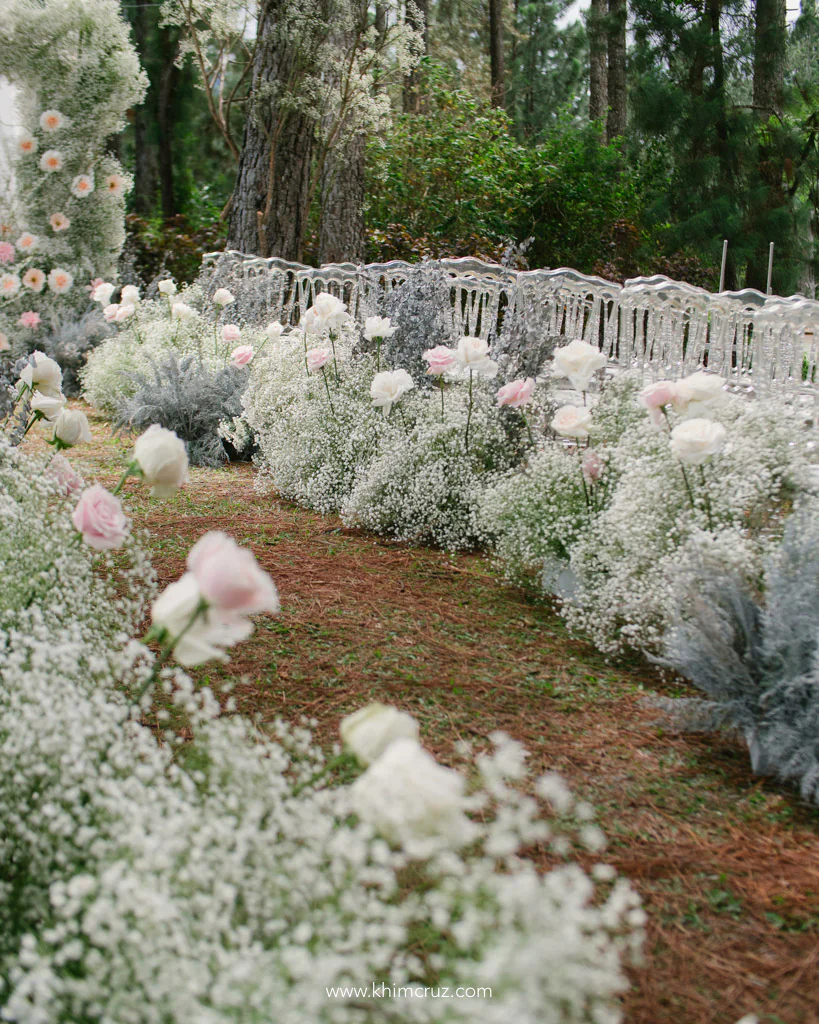forest theme wedding ceremony aisle floral details gypsophila for Christian and Jillian