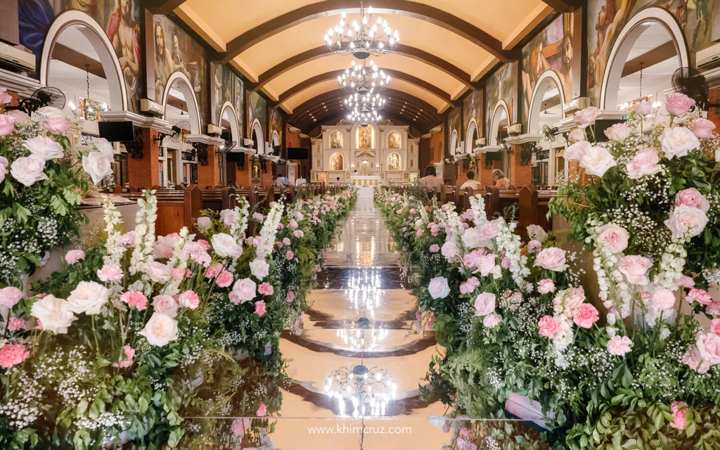 wedding ceremony setup for Anthony and Myka with over 140 feet of floral arrangement along the mirror panels