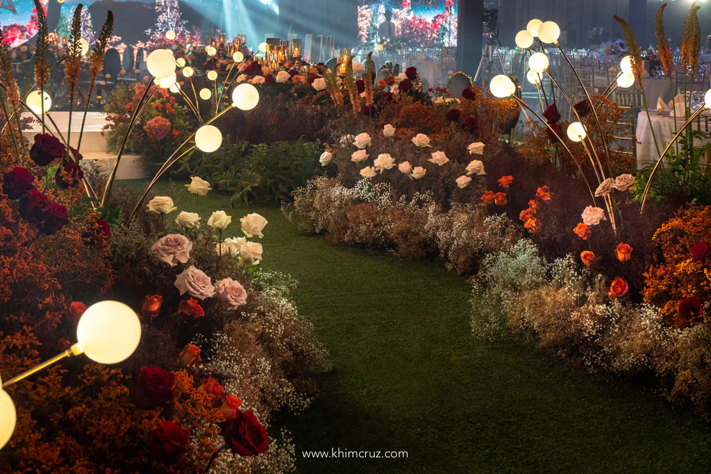 Autumn-inspired floral pathway for a romantic wedding reception by event stylist Khim Cruz