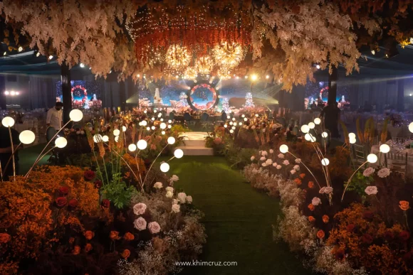 Romantic Autumn-inspired floral pathway to a wedding reception by Khim Cruz