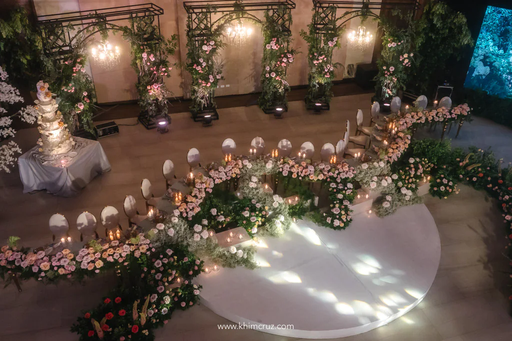 elegant garden-feel wedding reception of Uzziel and Patricia birds eye view showing head table dance floor and floral arches