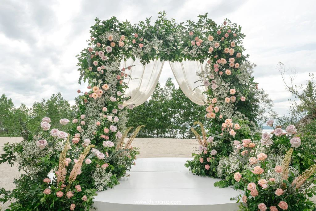outdoor dreamy wedding of Uzziel and Patricia entrance floral arch
