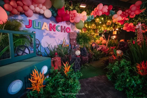 safari expedition themed birthday party entrance decor with safari animals
