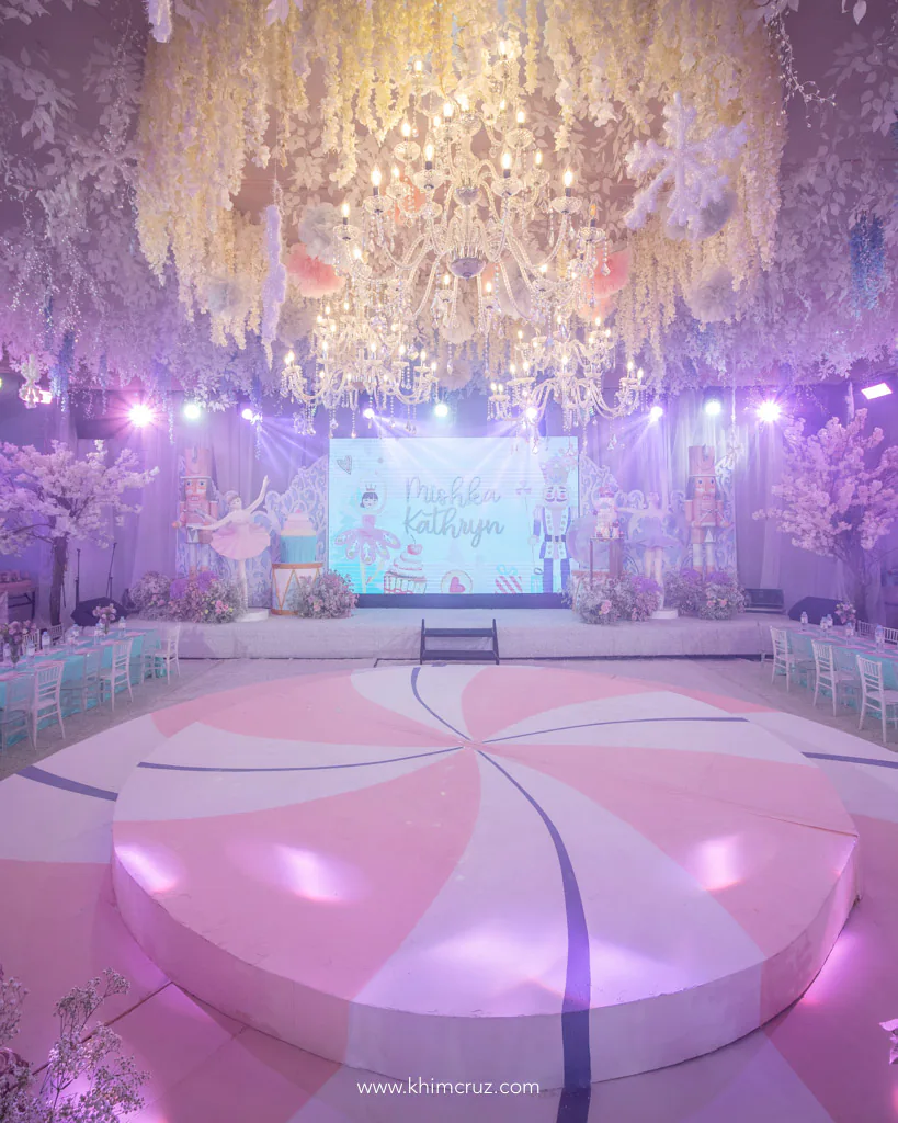 ballerina nutcracker theme birthday party of Mishka lollipop stage platform and chandeliers snowflakes as ceiling design by Khim Cruz