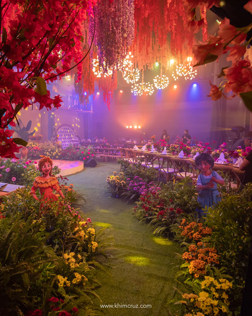 encanto theme birthday party casa madrigal floral pathway to courtyard