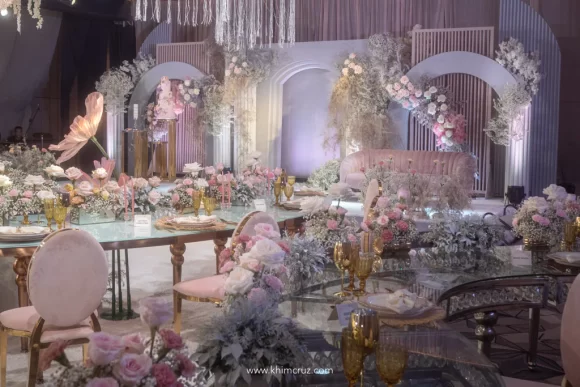 a dreamy debut ballroom reception stage backdrop with floral design works by Khim Cruz for a twin Brandie and Brielle