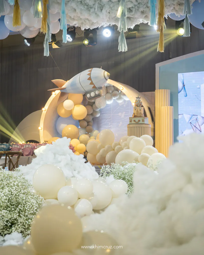 airplane theme birthday party of Alonzzo with 3D blimp flying above cloud by Khim Cruz