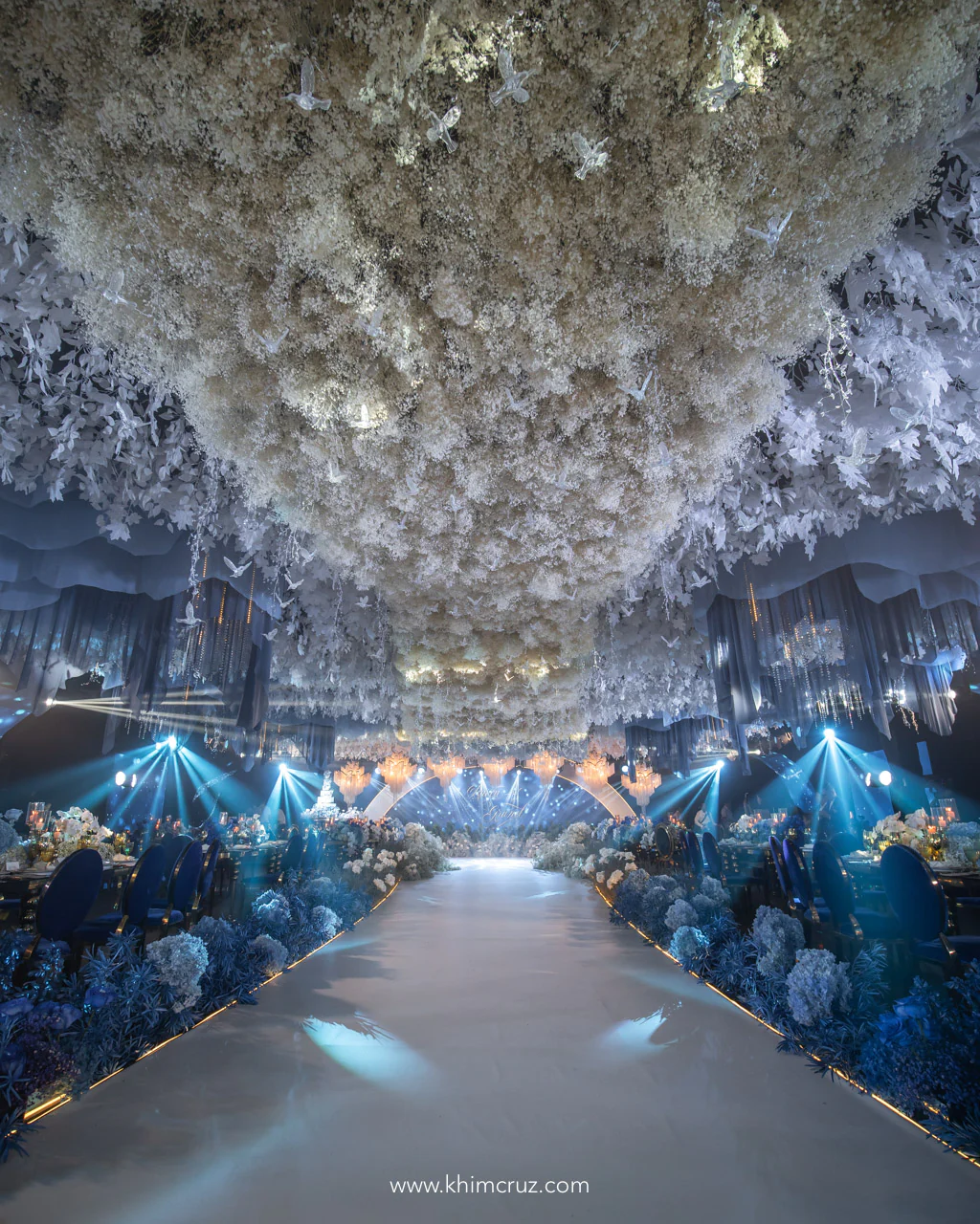 48 feet Gypsophilas hanged with crystals and birds as ceiling installation above cascading blue floral walkway designed by Khim Cruz
