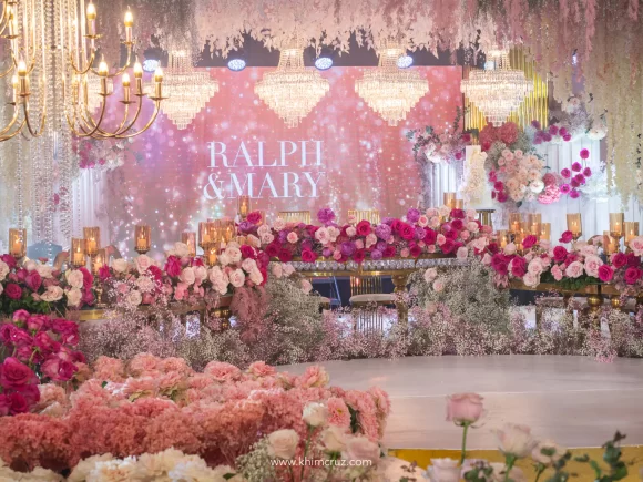 a dreamy pink hues floral blooms on presidential and head tables at the wedding reception for Ralph & Mary stlyed by florist Khim Cruz