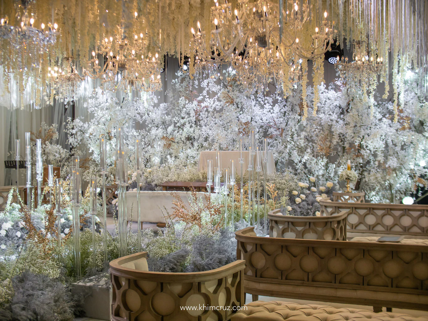 all white 50th golden wedding anniversary ceremony with hanging chandeliers