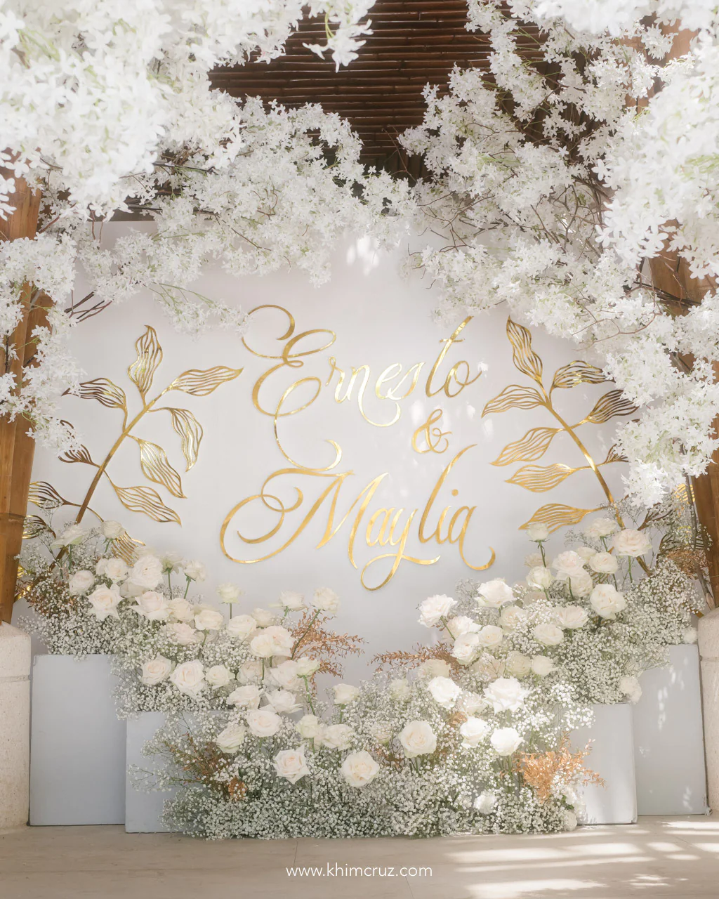 all white 50th wedding anniversary photowall for Ernesto and Maylia