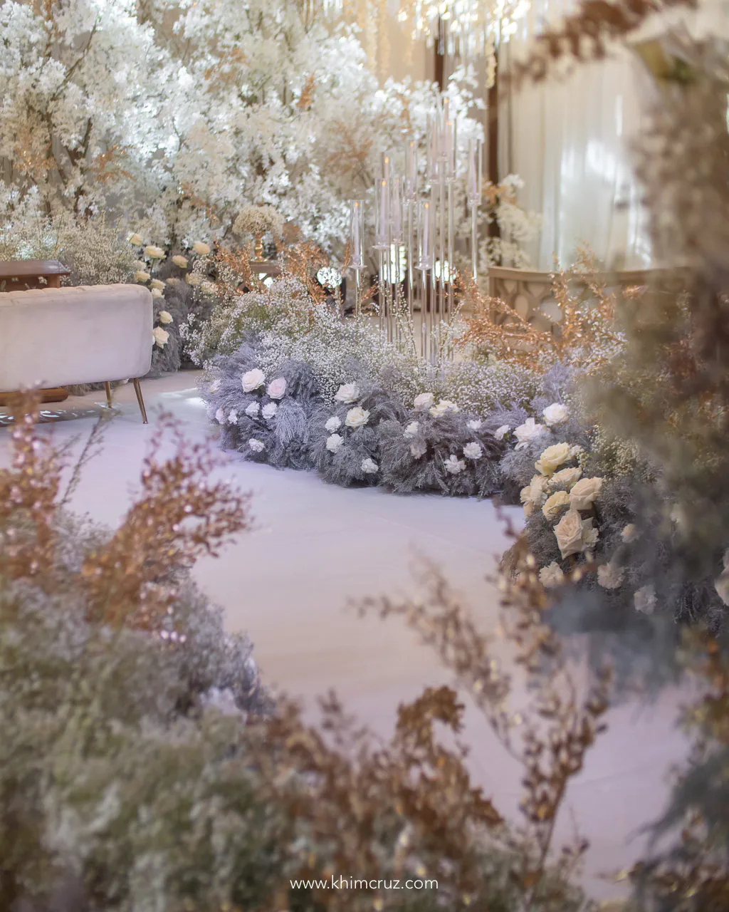 all white wedding ceremony aisle with a touch of gold for the golden wedding anniversary of Ernesto and Maylia